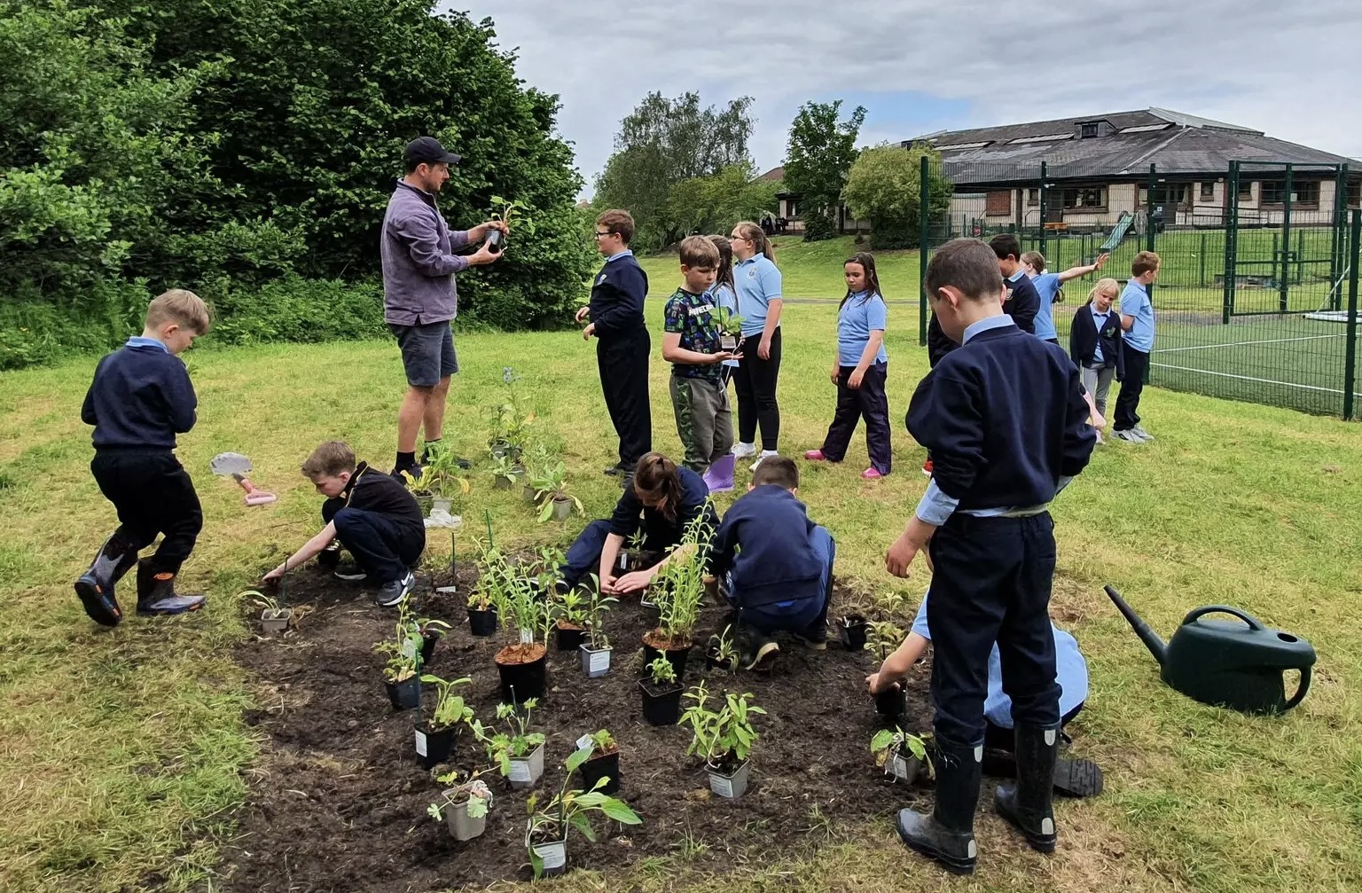 school kids gardening